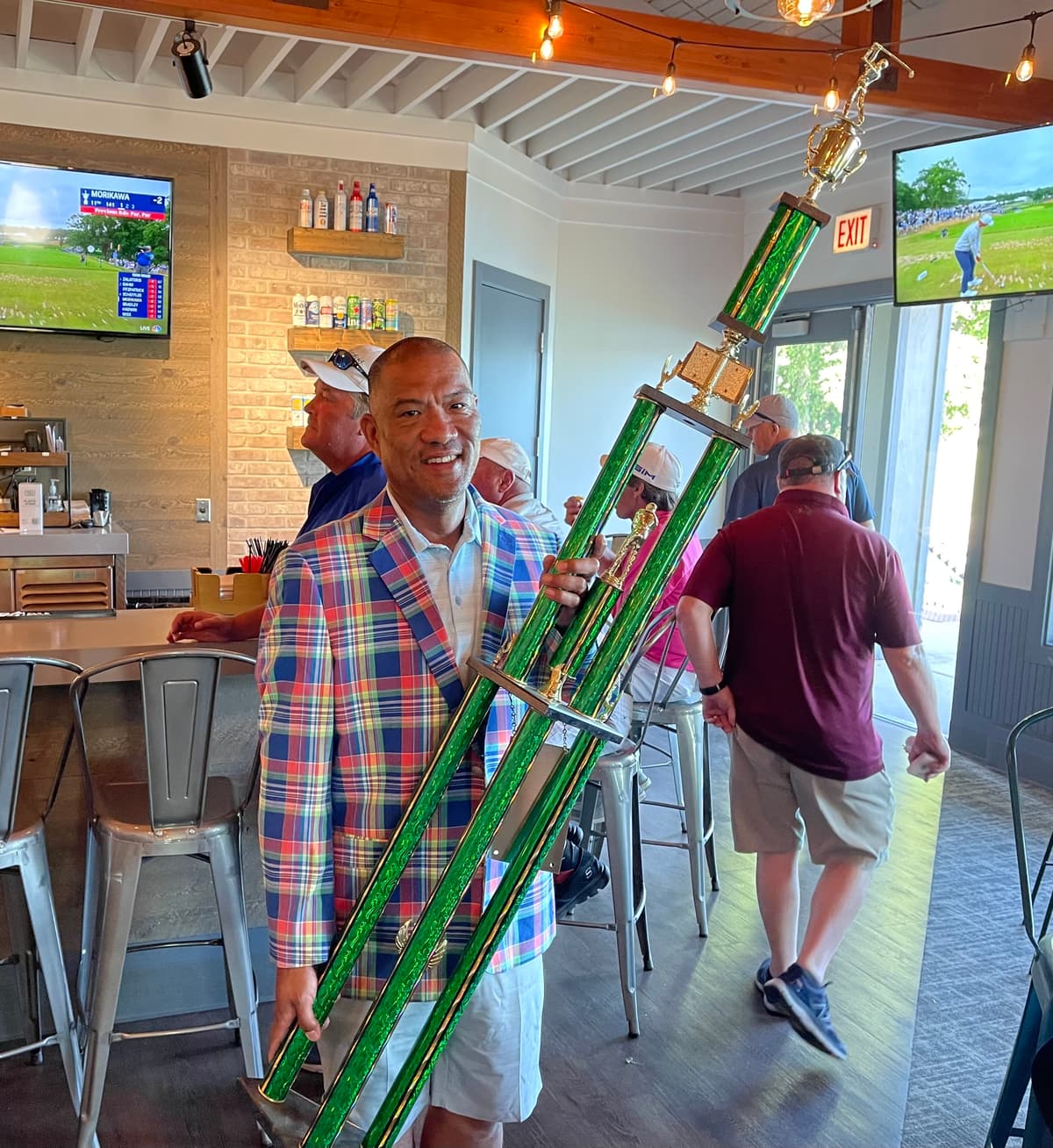 Pat Tallungan with golf trophy